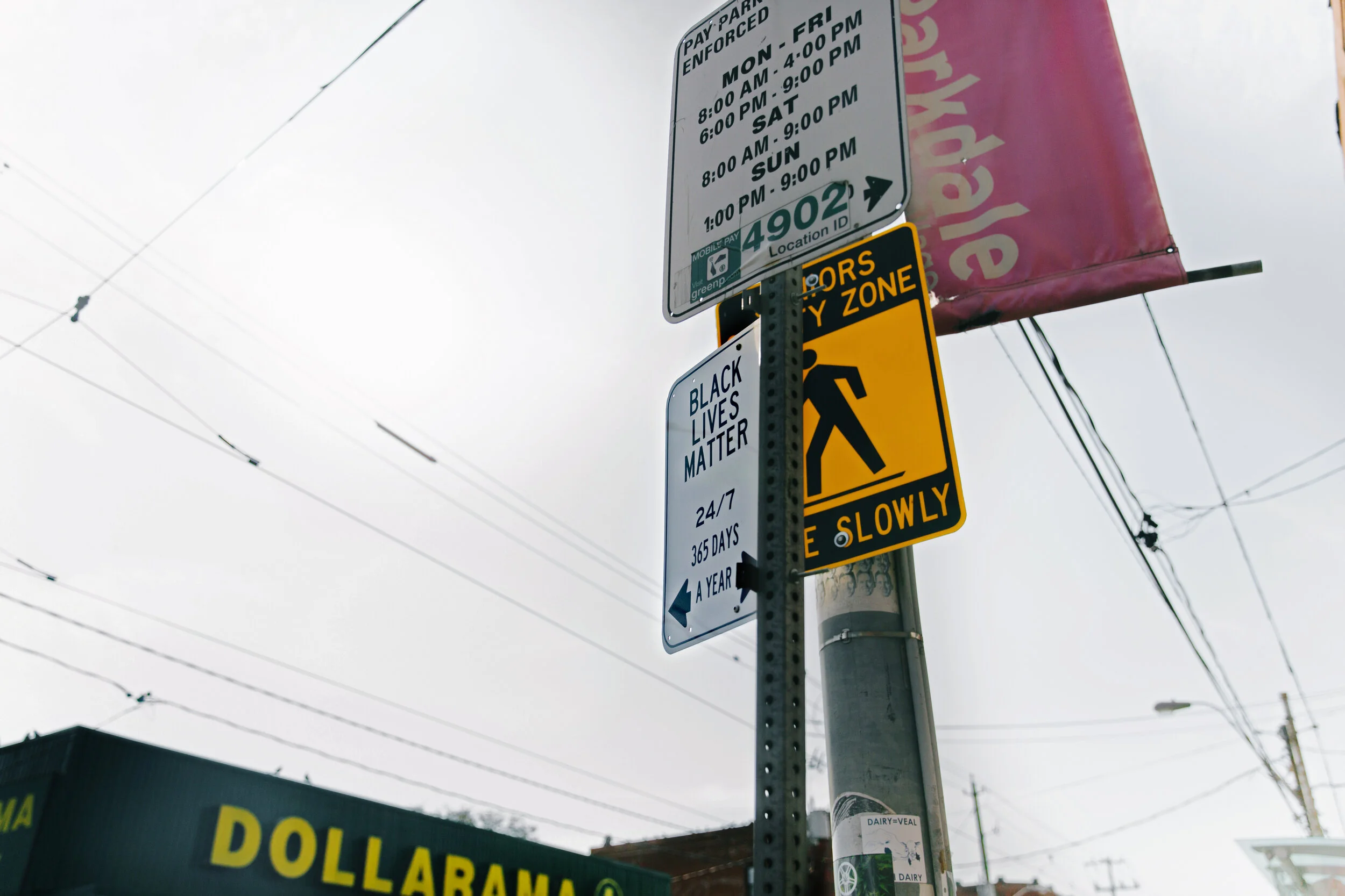 (2/2) Street art comes in different forms. What at first appears to be an official street sign amongst Toronto city parking regulations is actually a notice that reads “Black Lives Matter 24/7, 365 days a year.” The sign is positioned next to a P Par